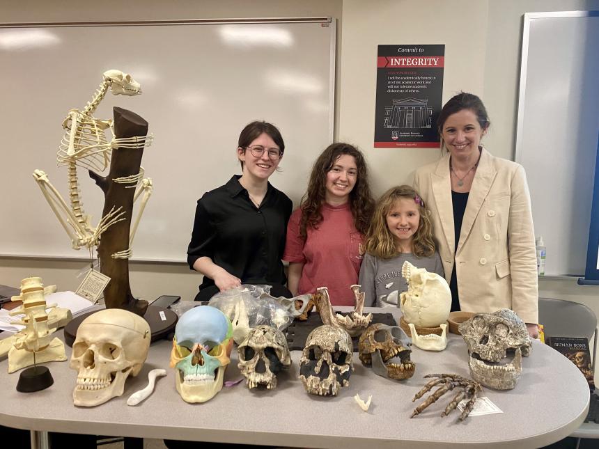 Left to right: Erin Summers, Madison Pickett, a young bone hunter, and Dr. Laurie Reitsema.