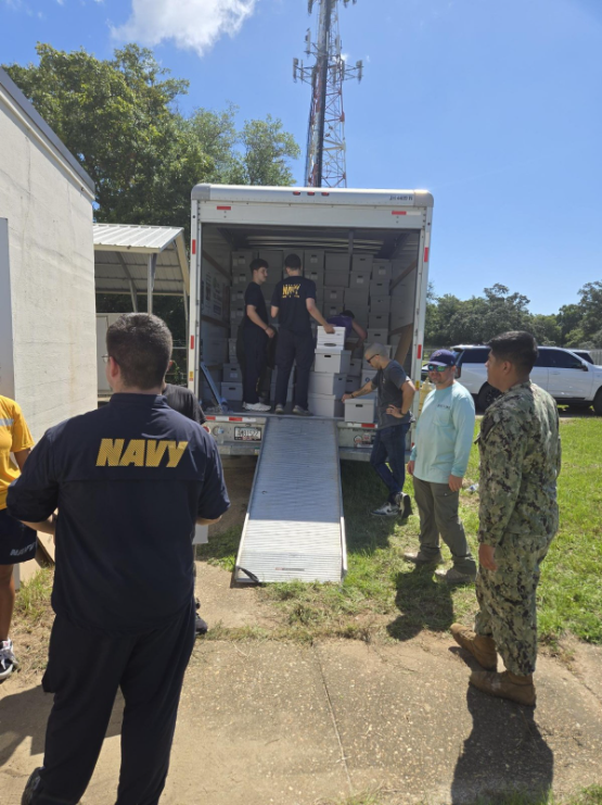 volunteers moving stuff