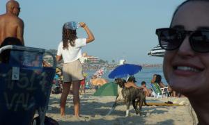 Raul Basilio: Anything can happen at a beach day in Rio de Janeiro. Anything! (on the right is my friend, Roberta. The dog in the back is Jubileu, he is never on a leash).