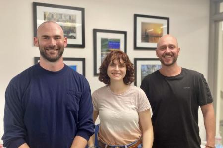 3 people smiling at the camera
